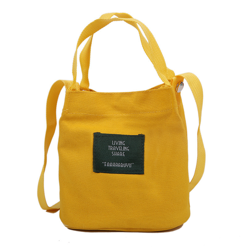 Bolso de mujer nuevo estilo coreano simple bolso de lienzo de chicas fresco de color sólido bolso de cubo de moda moda bolsa de mochila casual