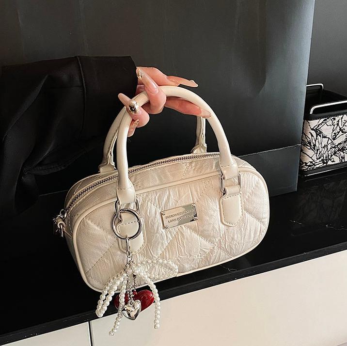 Bolsa de bolos de mano popular de este año para mujeres 2025, nueva bolsa de hombro de tendencia universal de alta calidad, bolso cuadrado de estilo extranjero