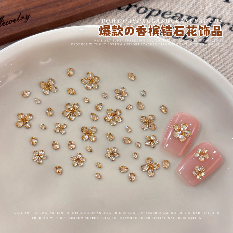 Nail art zircon flower ornaments, champagne zircon flowers, new and popular styles, available in various sizes, zircon water droplet DIY nail decorations Nail art zircon flower ornaments, champagne zircon flowers, new and popular styles, available in various sizes, zircon water droplet DIY nail decorations
