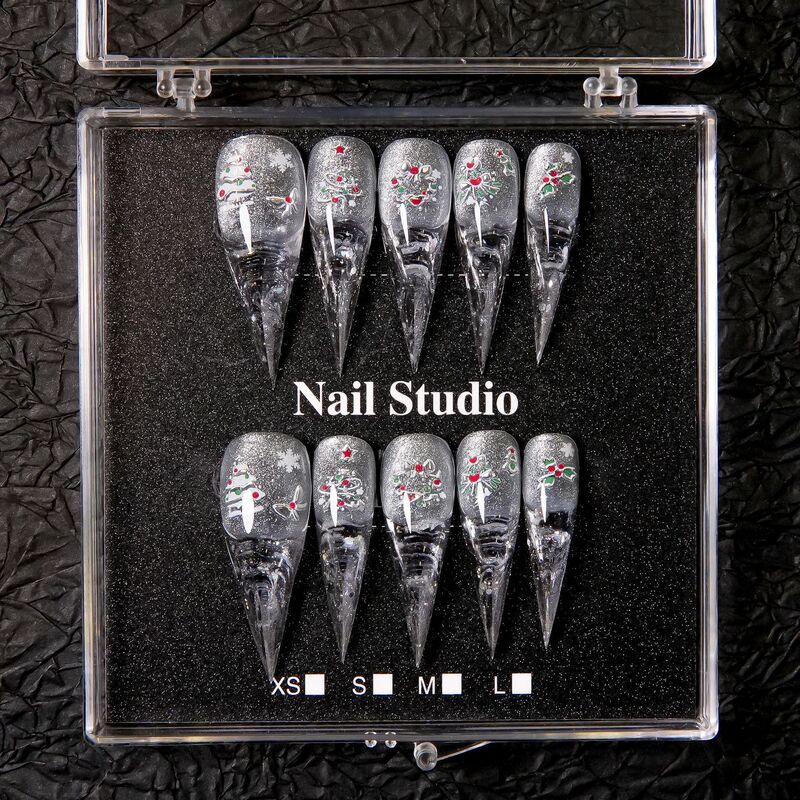 Winter limited edition Christmas-themed press-on nails with silver glitter and diamond accents, hand-painted Christmas tree design, long almond-shaped tips, holiday false nails