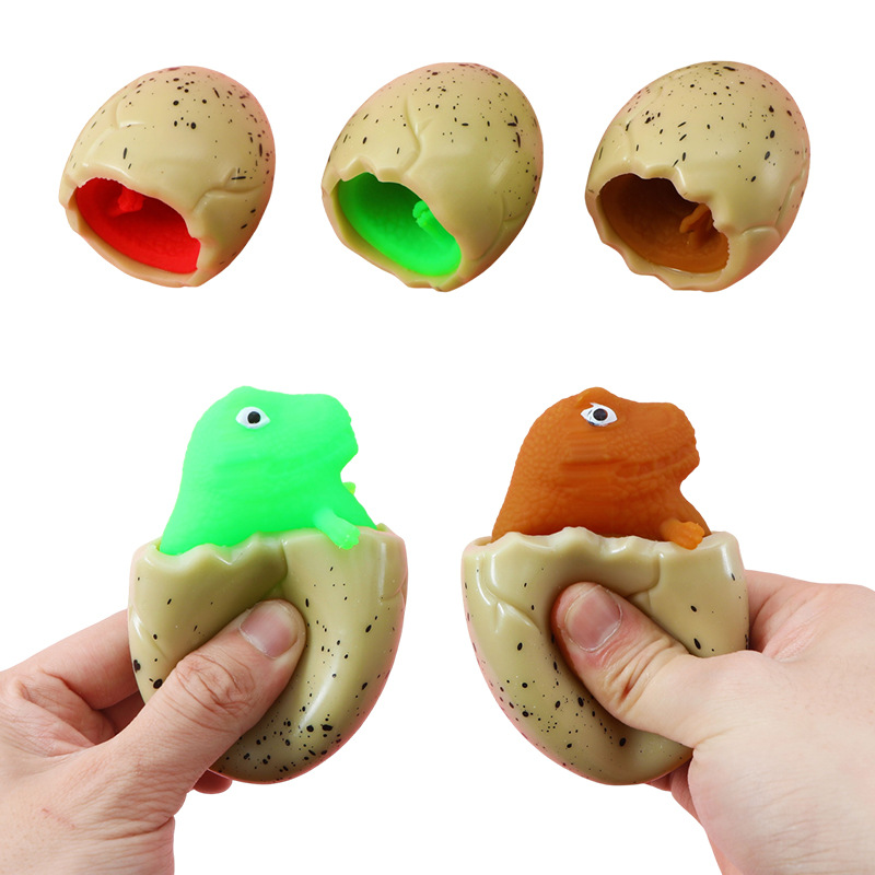 Red famosa novedad huevo de dinosaurio extruido juguete taza de dinosaurio para niños pellizco pellizco de escape bola de escape pegamento suave huevo