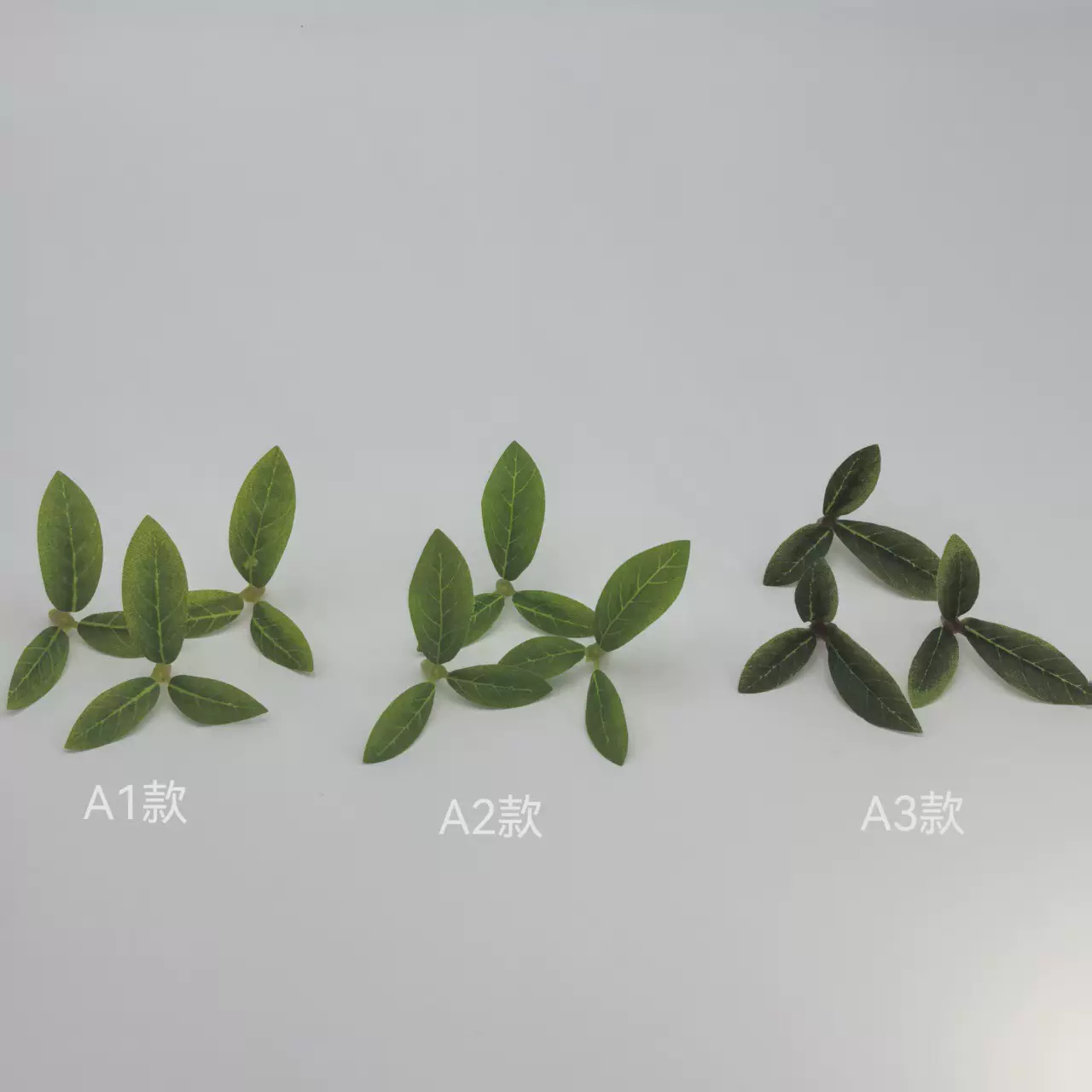 厂家直供仿真小三叉石榴叶仿真绿植物装饰软装工程植物墙现货批发