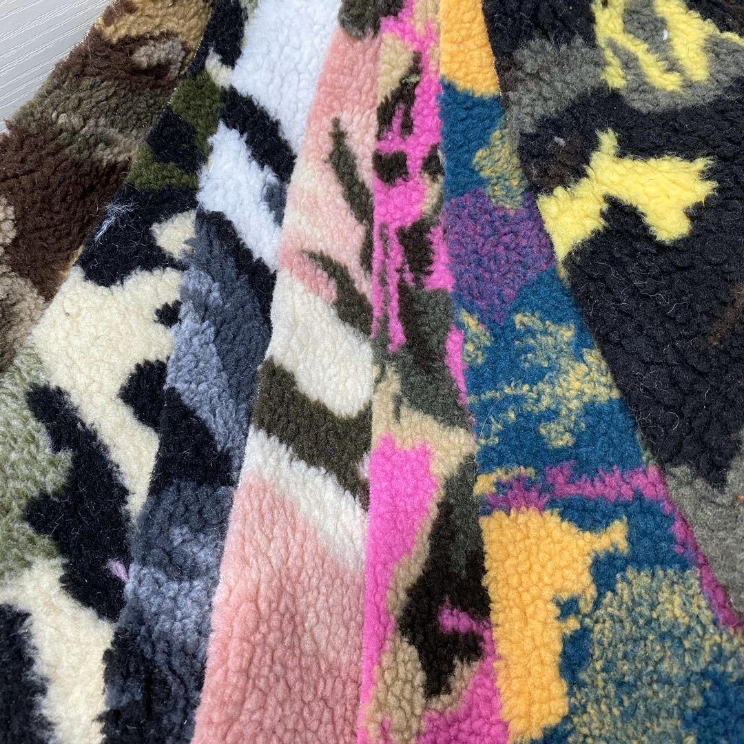 Jacquard lana de cordero nuevo camuflaje animal de tres colores tela de ropa de juguetes de cachemira