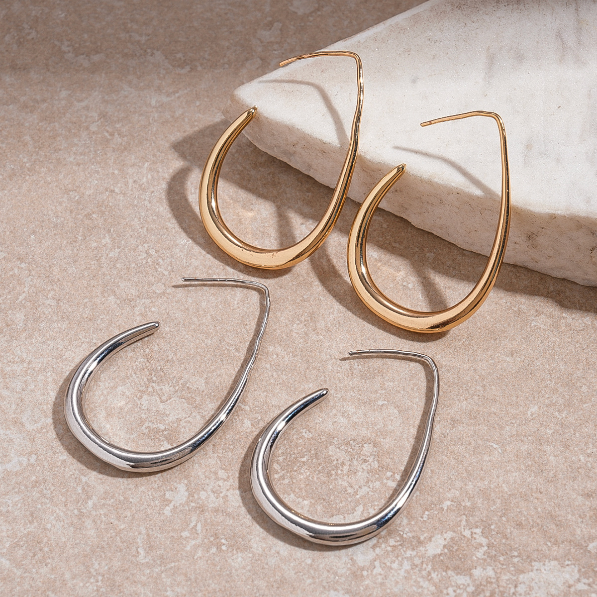 Europa y América metal transfronterizo agujero gancho de gotas de agua aire frío personalidad simple pendientes de nicho de alta calidad pendientes para mujeres