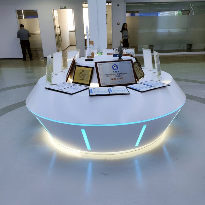 Customized Painted Oval Display Stand, Cool and Tech-Savvy Drone Display Cabinet, Illuminated Island Experience Table Customized Painted Oval Display Stand, Cool and Tech-Savvy Drone Display Cabinet, Illuminated Island Experience Table