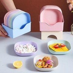 骨を吐く小皿のごみの皿は台座のテーブルの小皿の家庭用果物のスナック皿を持っています。