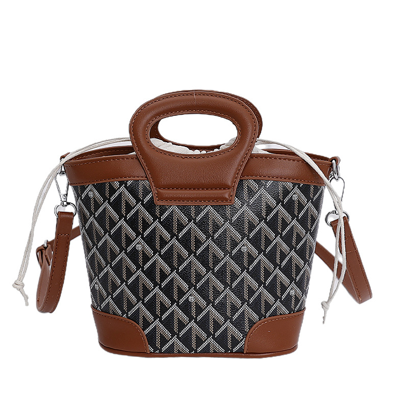 Bolsa de cubo de tela coreana para mujeres 2025 nueva moda transfronteriza nicho de alta calidad bolso de hombro