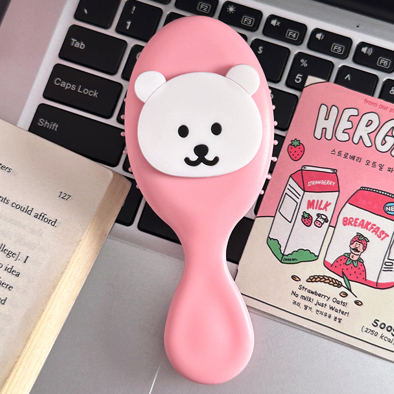 자조적인 곰 핑크색 손잡이 빗