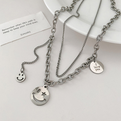 Instagram-worthy hip-hop smiley face necklace for women—delicate, minimalist design, lightweight luxury, niche aesthetic, made from titanium steel—perfect as a double-layered neck accessory.