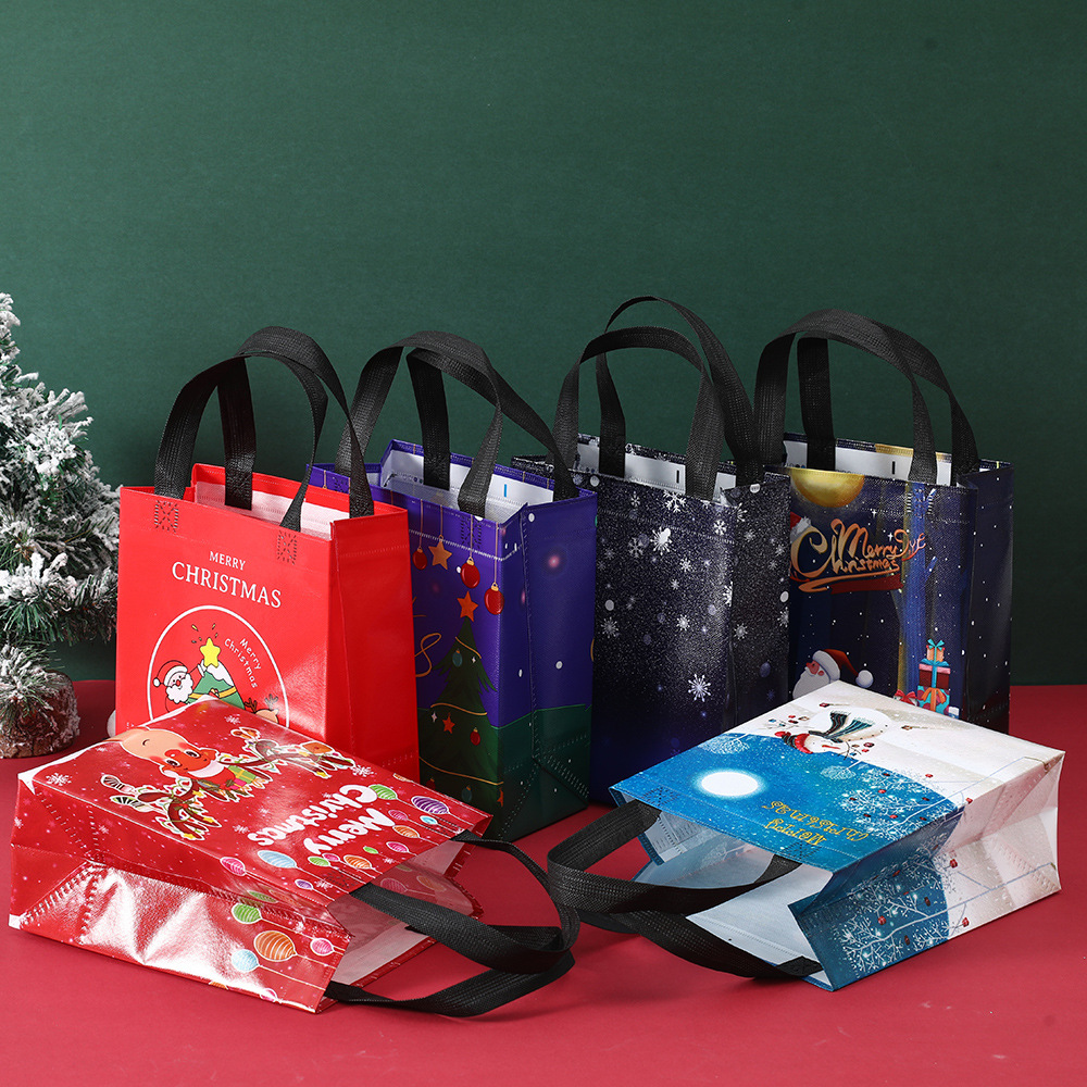 Bolsa de regalo de Navidad en stock fábrica al por mayor bolsa no tejida recubierta prensada en caliente bolsa de Protección Ambiental logotipo imprimible