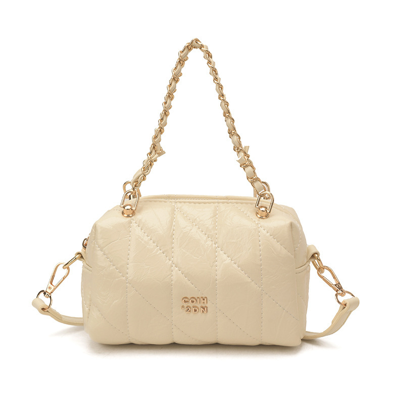 Bolsa de estilo de viaje de cadena de diamante para mujeres 2026 nueva sensación diaria de estilo extranjero bolso de hombro otro medio