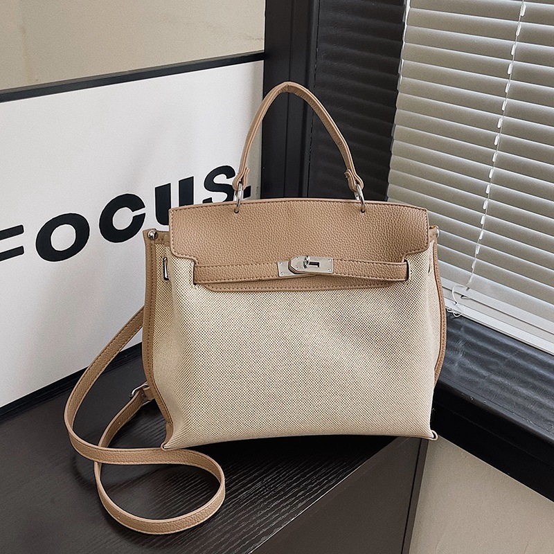 Bolsa de mano transfronteriza para mujeres 2026 nueva tela de lino empalmada color de textura de viaje mochila de hombro