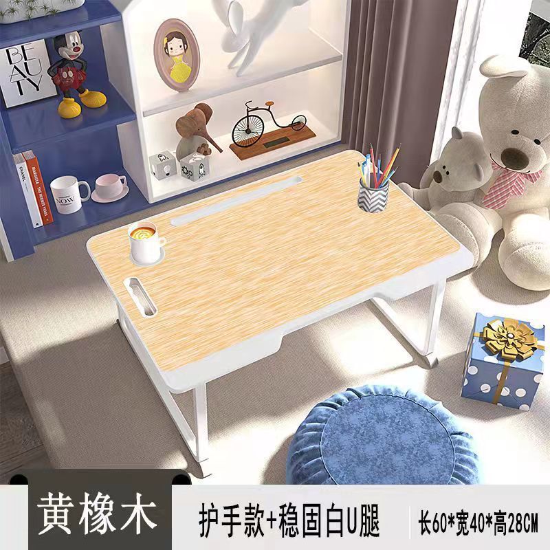ベッドの上のノートパソコンの机の学生寮は小さいテーブルの部屋を畳むことができます。|undefined