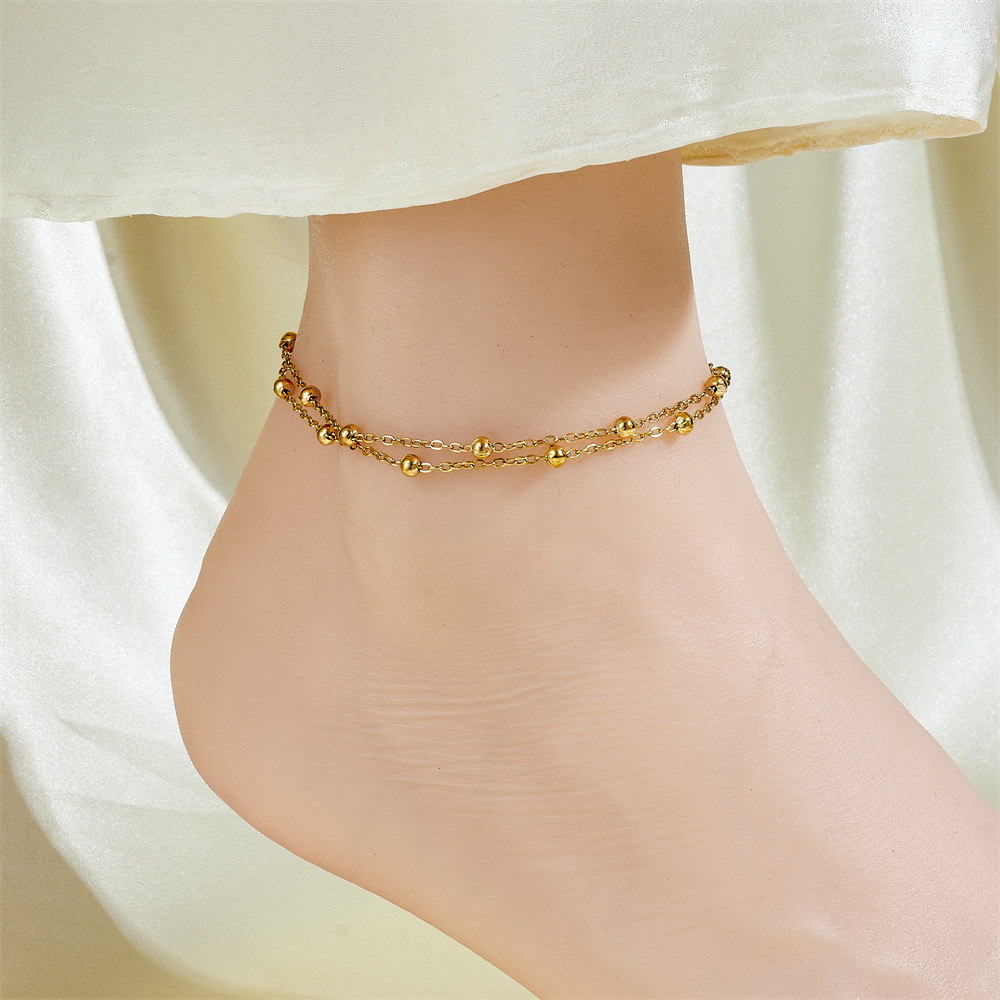 Cientos de tobilleras, tobilleras de lujo simples y ligeras, sentido femenino, accesorios de celebridades de Internet, temperamento de moda dorado de 18 quilates, cadena de pie de acero de titanio sexy