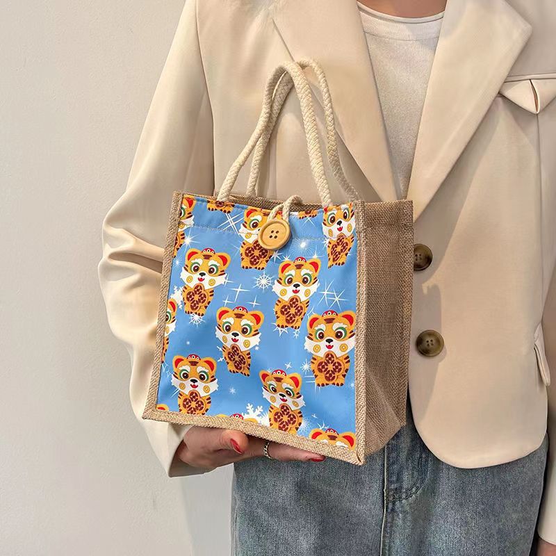Algodón y lino Bento bolso bolsa para las mujeres 2022 Nuevo Tigre año de estilo occidental caja de almuerzo bolsa ins gran capacidad pequeña bolsa de hombro