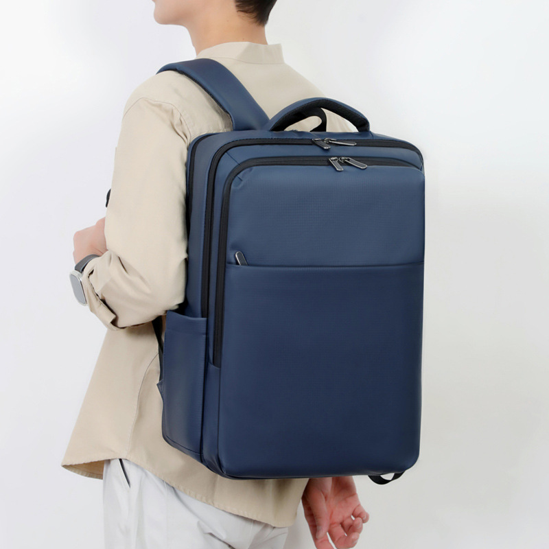 Color sólido transfronterizo de alta calidad sensación de mochila de gran capacidad USB colgar varilla de tracción bolsa de computadora de negocios mochila de negocios a prueba de rociadores