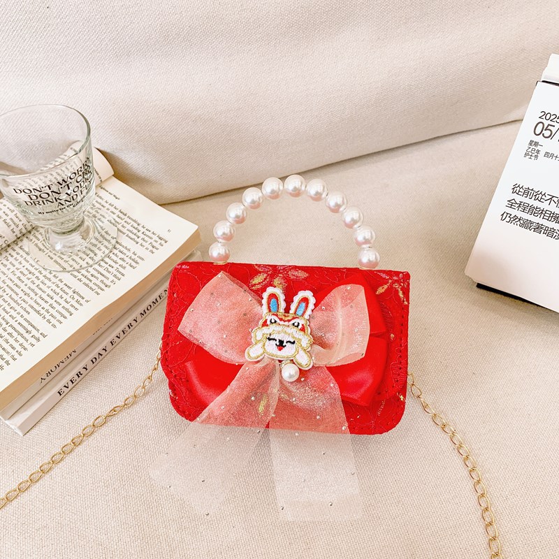 Pequeño viento rojo perfumado bolsos de Año Nuevo para niños y niñas lindos bolsos de perlas de arco 2025 nuevos bolsos de cadenas para niños