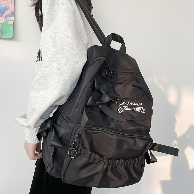 Nuevo anime japonés estilo universitario adorable arco de contraste de color plegado suave mochila de estudiantes mujeres
