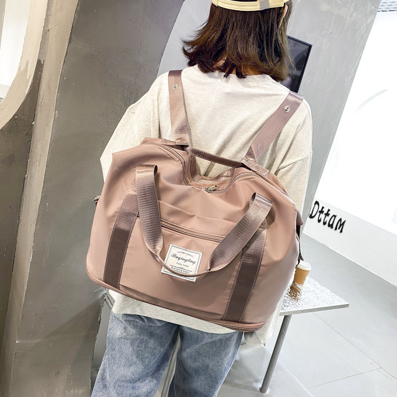 Nueva mochila portátil de gran capacidad bolsa de equipaje para hombres y mujeres de viaje ligero de corta distancia mochila multifuncional de moda