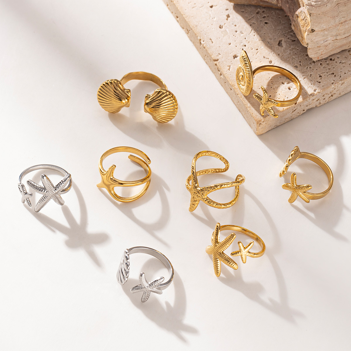 Anillo de acero inoxidable europeo y americano Taina, lujo ligero, sentido de alta gama, vacaciones en el océano, anillo de concha de estrella de mar de playa, diseño de todo fósforo