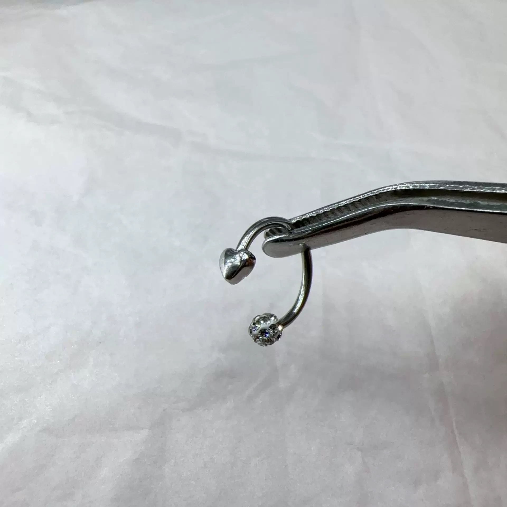 Silver pointed spike labret stud material detail