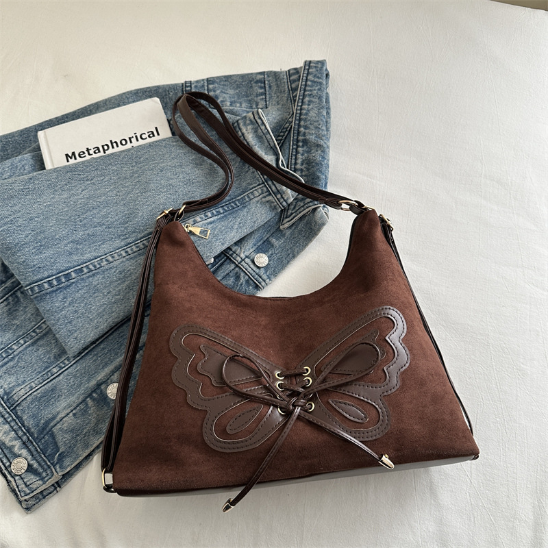 Bolsa de viaje retro ocio de otoño y invierno de 2024 nueva bolsa de hombro mariposa axillar multicapacidad de mochila