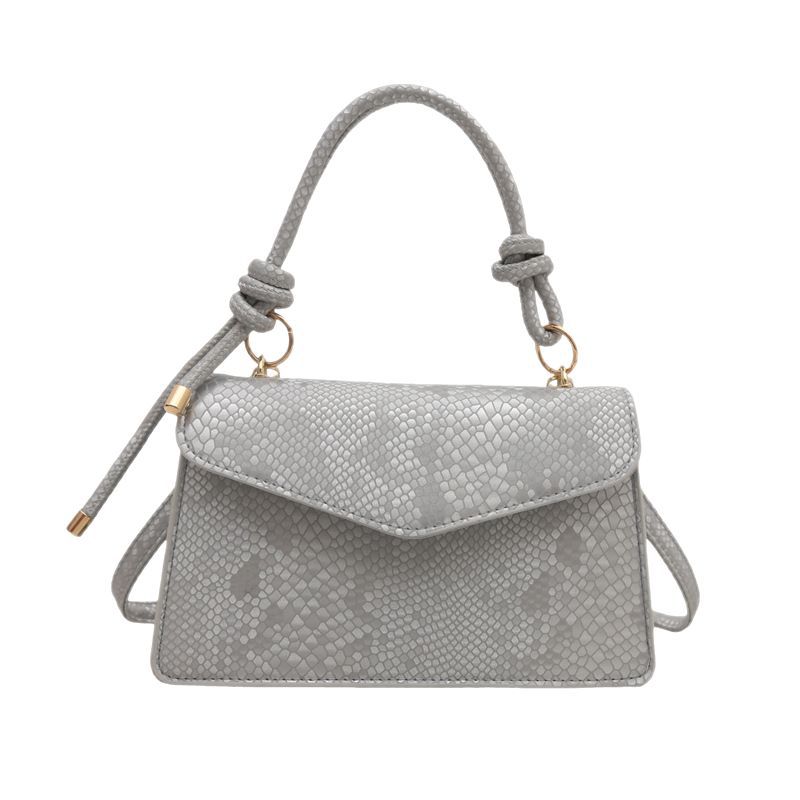 Bolso con estampado de piel de serpiente de diseño de nicho de lujo ligero transfronterizo para mujer 2025 nuevo bolso de mensajero de un solo hombro