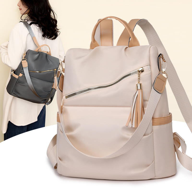 Spot al por mayor 2025 nueva mochila antirrobo casual para mujer moda borla mochila para mujer de gran capacidad marea