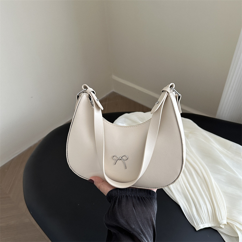 Bolso de axila con lazo para mujer 2024 nuevo estilo literario minimal bolso de hombro textura de viaje de moda de luna nueva marea