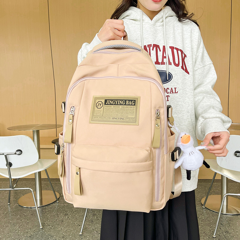 Nueva mochila escolar de estudiantes de secundaria y secundaria de nylon de moda universal mochila casual para hombres y mujeres para viajar mochila de computadora