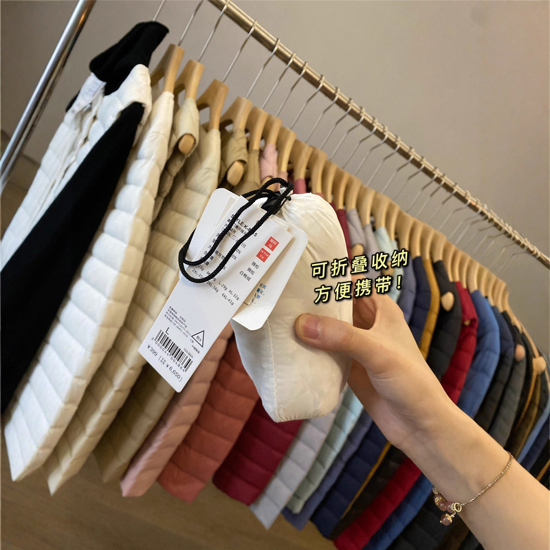 90 white duck down! Autumn and Winter lightweight solid color round neck down vest/down jacket with storage bag