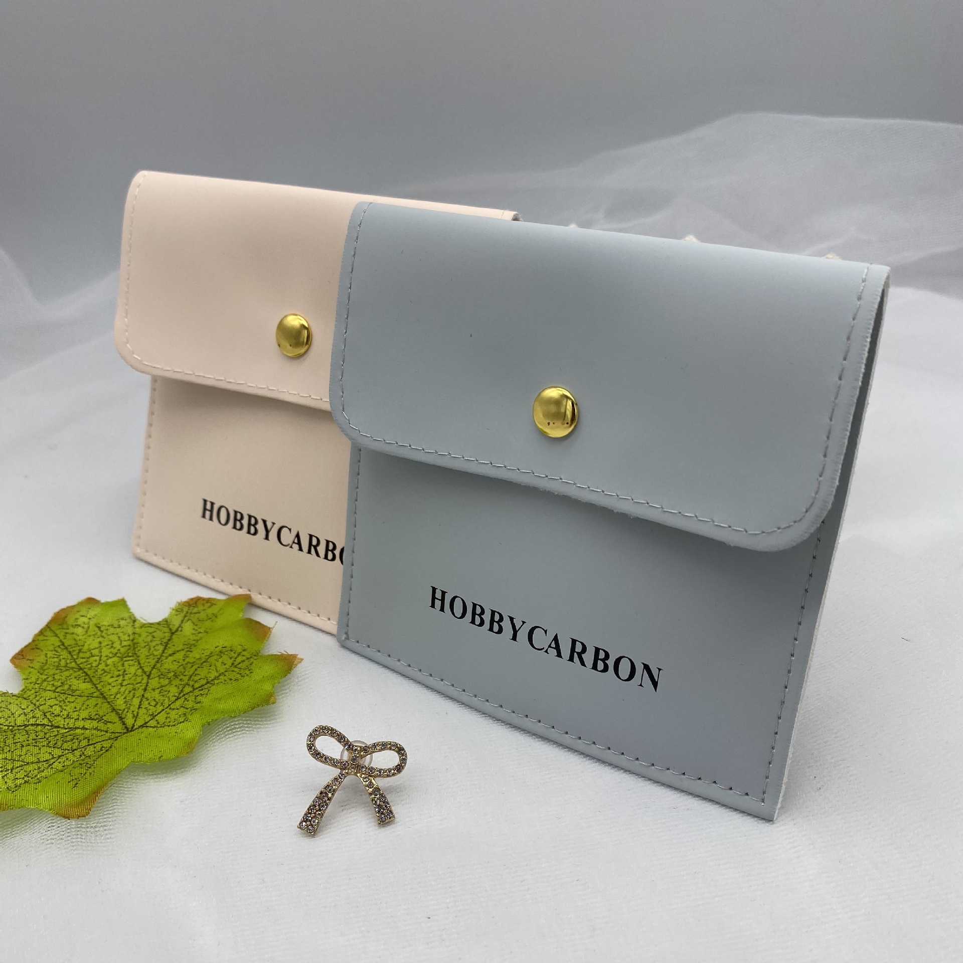 厂家批发PU按扣袋手串项链戒指珠宝首饰包装收纳袋免费打样设计