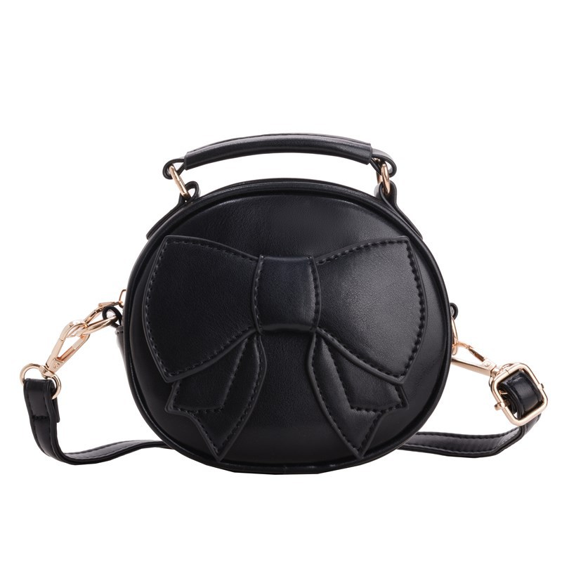 Bolsos para niños mini lindos arcos para hombres y mujeres, bolsos redondos para niños 2025 moda coreana nueva bolsa de cambio para niños