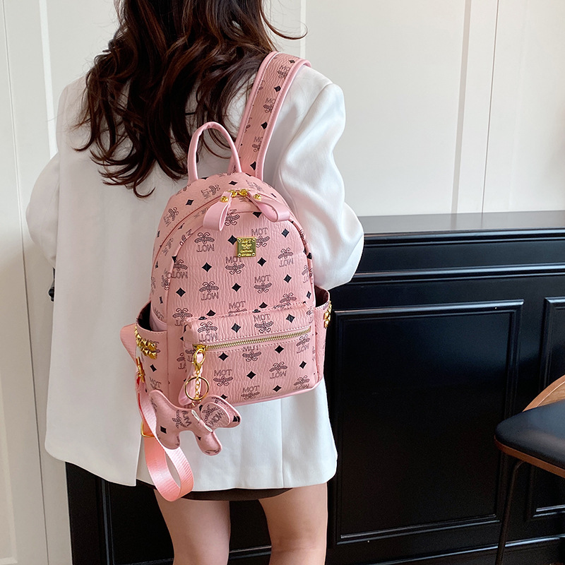 Mochila de moda coreana impresa para mujeres, mochila de clase para estudiantes universitarios, adornos colgantes, mochila de viaje de gran capacidad para mujeres