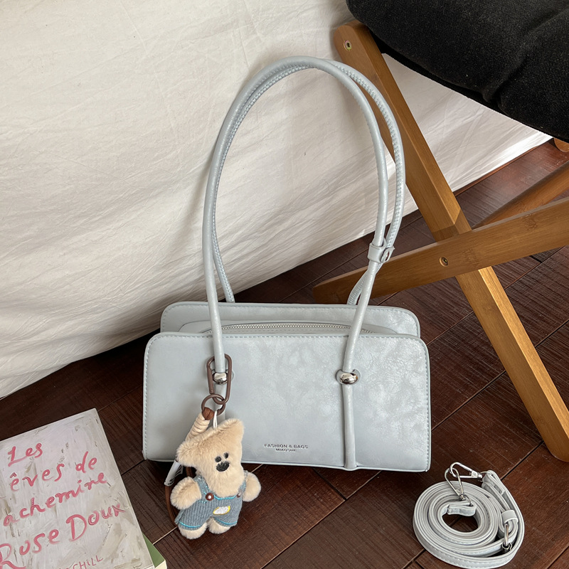 Simple retro bolso pequeño para mujeres 2026 nuevo bolso de estilo extranjero super caliente nicho diseño diario viaje bolsa de hombro