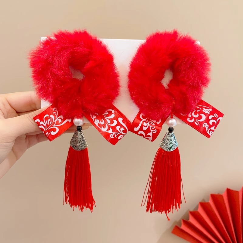 16 bolas de pelo rojo con borlas de viento