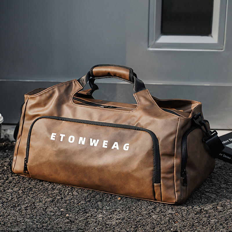 Wholesale in-stock, large-capacity gym bags with separate wet and dry compartments, independent shoe compartments, short-trip travel bags, luggage bags, and sports shoulder bags.