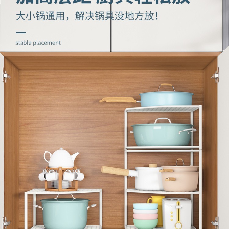 台所の棚のテーブルの角の鍋の収納棚の下の水槽の鍋棚の食器棚の中に鍋の階層棚の神器を入れます。|undefined