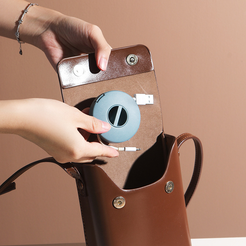 Pequeño portátil redonda giratoria cable de datos organización caja de almacenamiento teléfono móvil cable de carga Winder