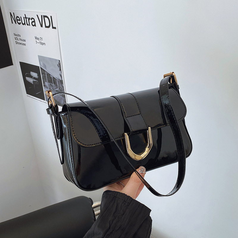 Bolso de alta gama, bolso de axila portátil de moda retro para mujer, bolso de mensajero de un solo hombro, bolso femenino de diseño de nicho de nuevo estilo 2025