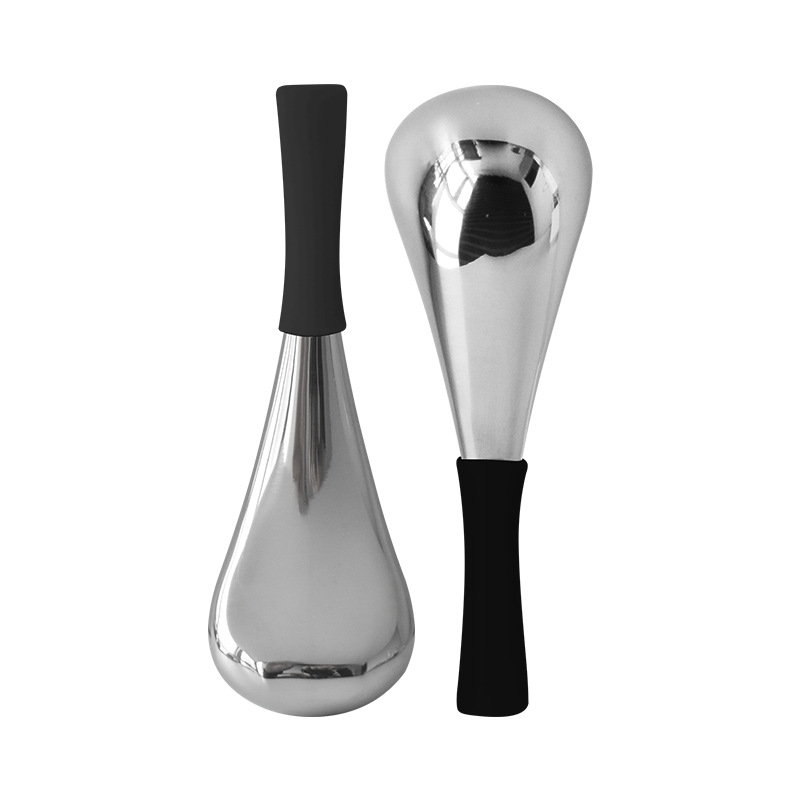 A pair of small black ice spoons