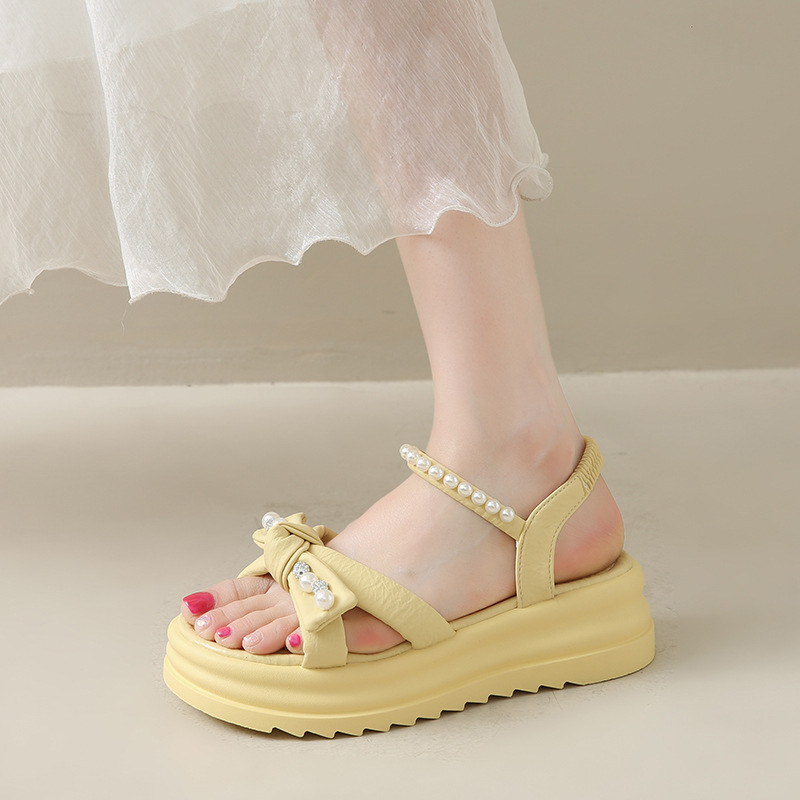 fashionable romantic and delicate beach sandals with bow