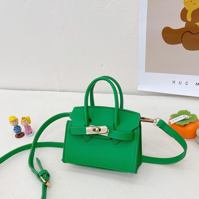 Bolsa para niños nueva pasarela europea y americana moda bolsa de platino estilo occidental niña bolsa de mensajero forma cóncava monedero comercio exterior