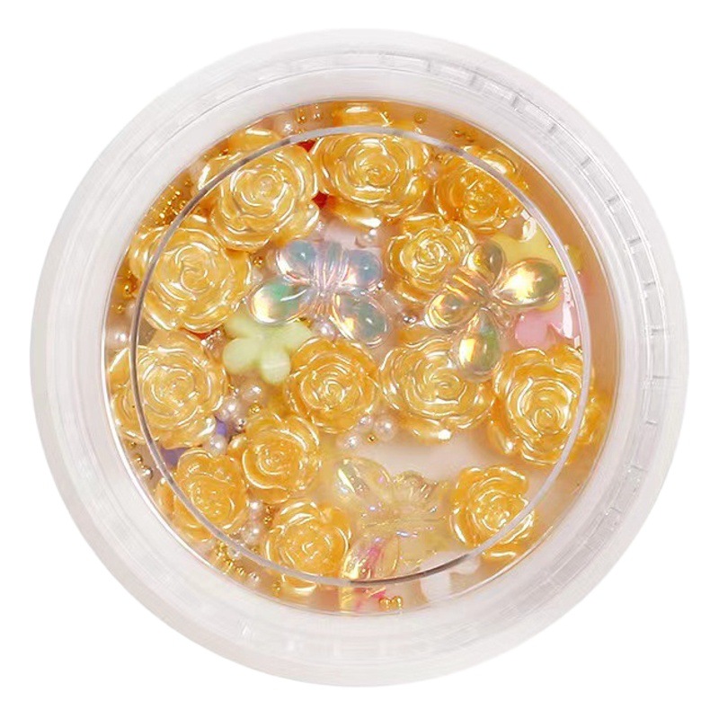 Nueva celebridad en línea suministros de uñas 3D multicolor de alto grado Camelia mariposa cinco pétalos flor bola de acero joyería de uñas diamante