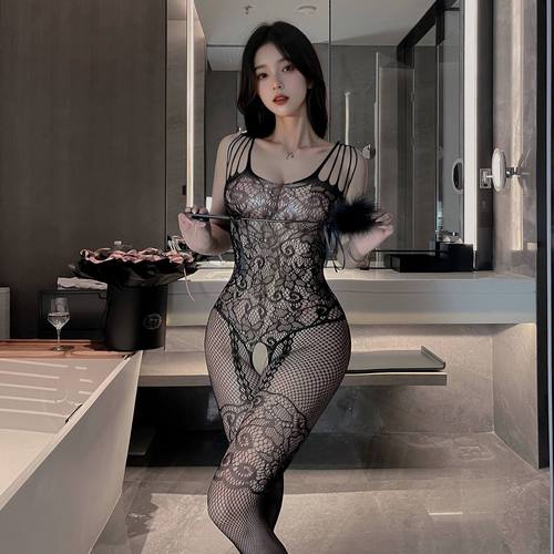 Plus-size women's flirtatious fishnet bodysuit with a tearable crotch—sexy, hollowed-out full-body black silk look that exudes pure allure.