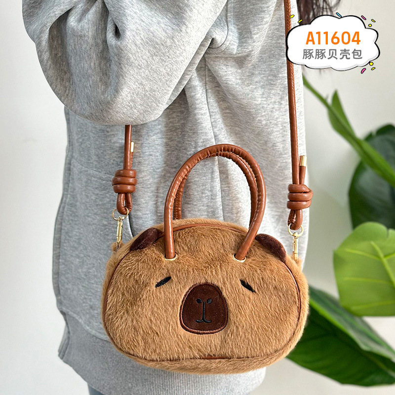 Bolsa de conchas de animales de peluche de red Kapibara muñeca del Dolphin de agua mochila de 8 pulgadas bolsa agarrada al por mayor en stock