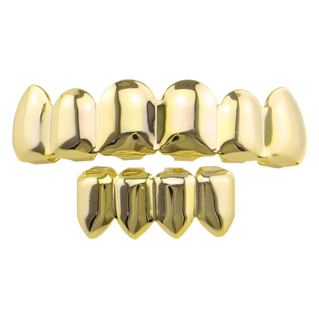 Europea y americana joyería brillante hueco colmillos hip hop tirantes para hombres y mujeres mismo Grillz18K electrochapado cobre oro dientes