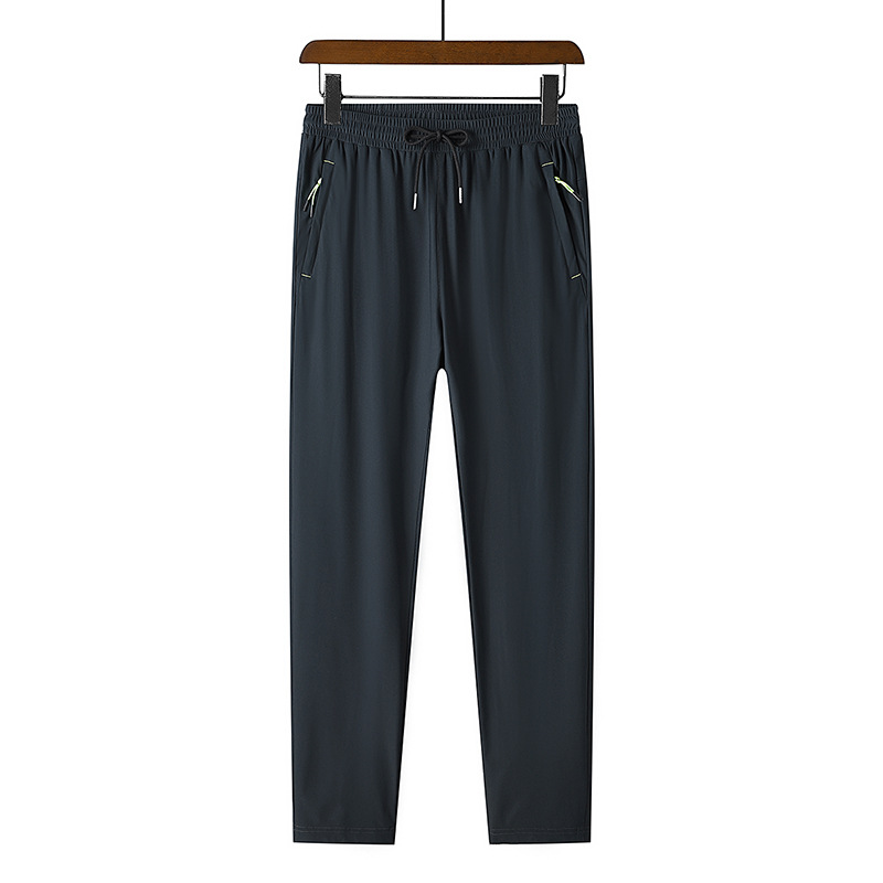 Pantalones delgados de verano de los hombres de ocio pantalones largos Pantalones deportivos elásticos de secado rápido hombres sueltos fertilizantes más tamaño al por mayor
