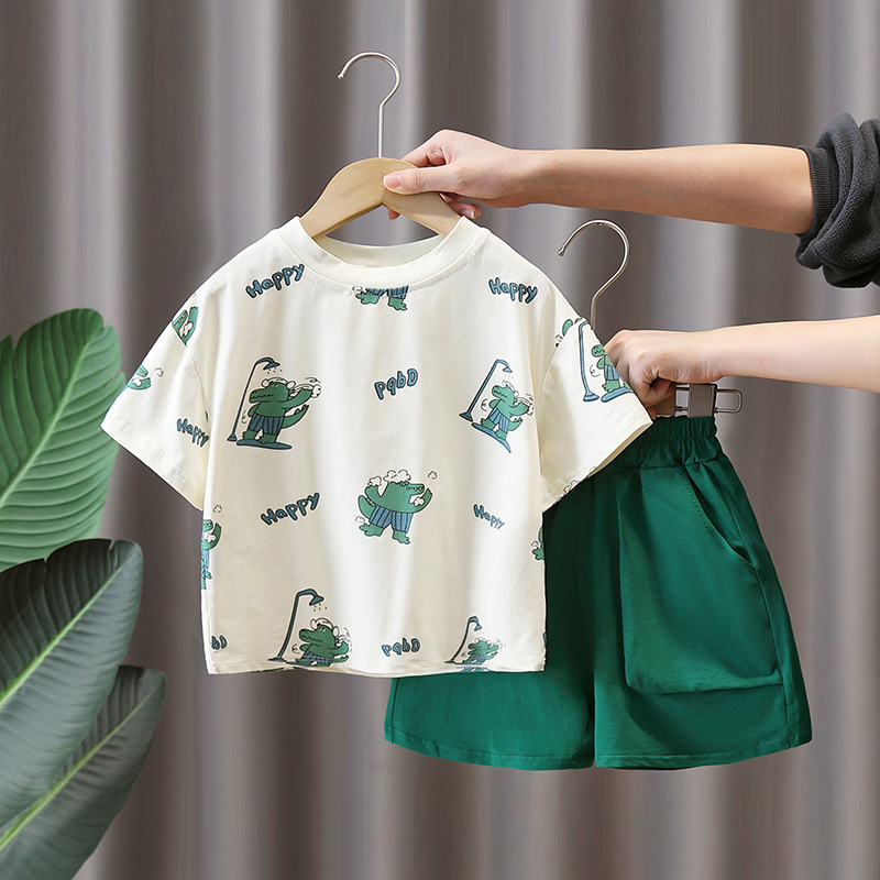 7947 Traje de manga corta para niños 2025 Nuevo verano Camiseta con estampado de dinosaurios de dibujos animados para niños Ropa de moda de verano