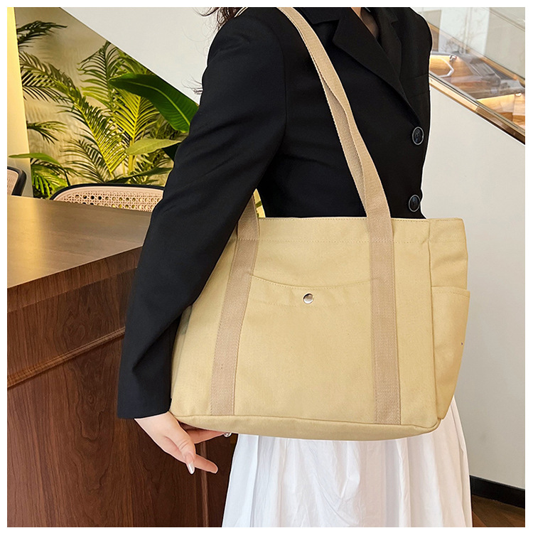 Wholesale of new women's single-shoulder bags, cross-border simple and casual canvas bags, Korean version LOGO printed commuter tote bags undefined
